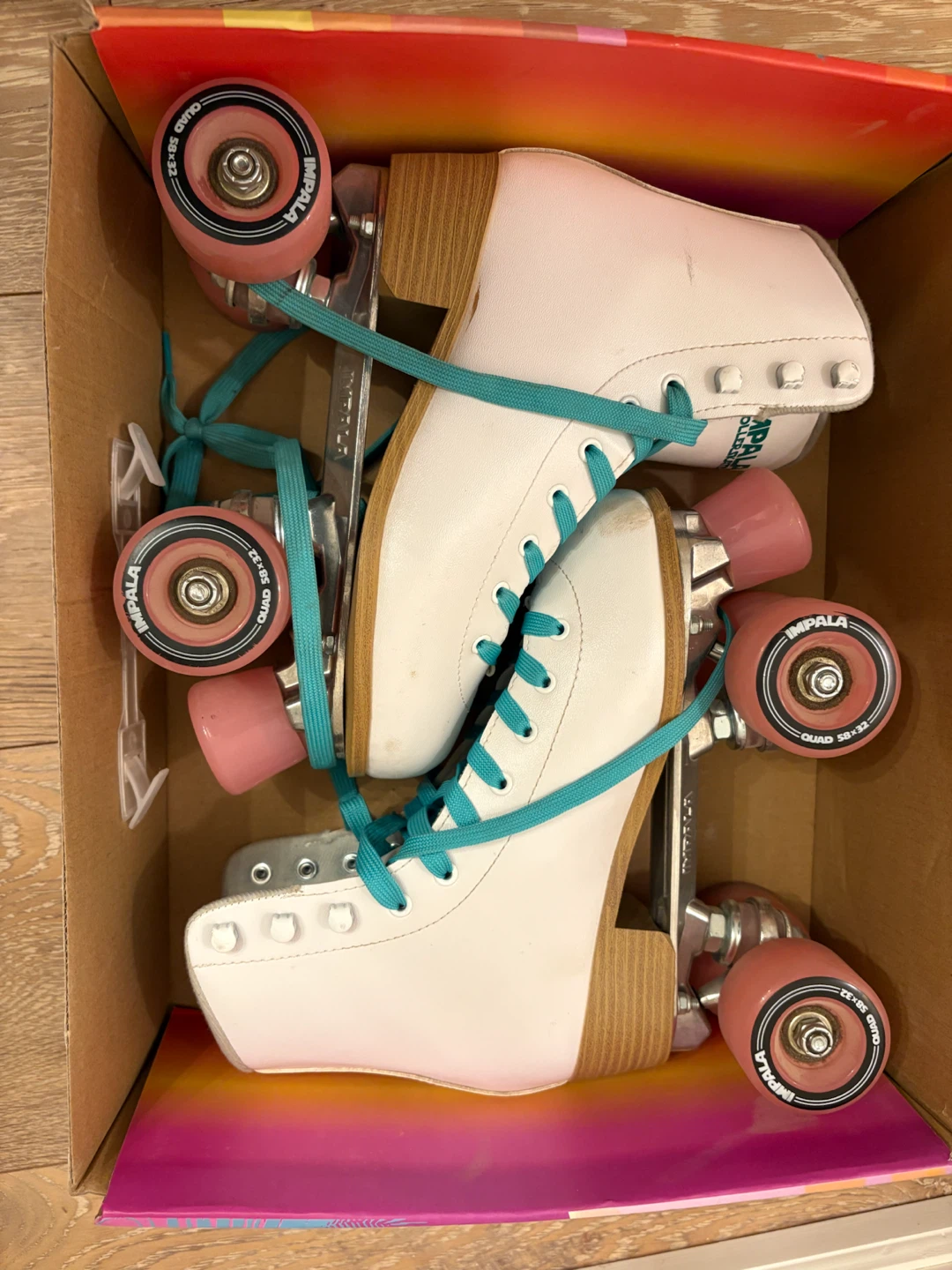 Impala White Roller Skates with Teal Laces
