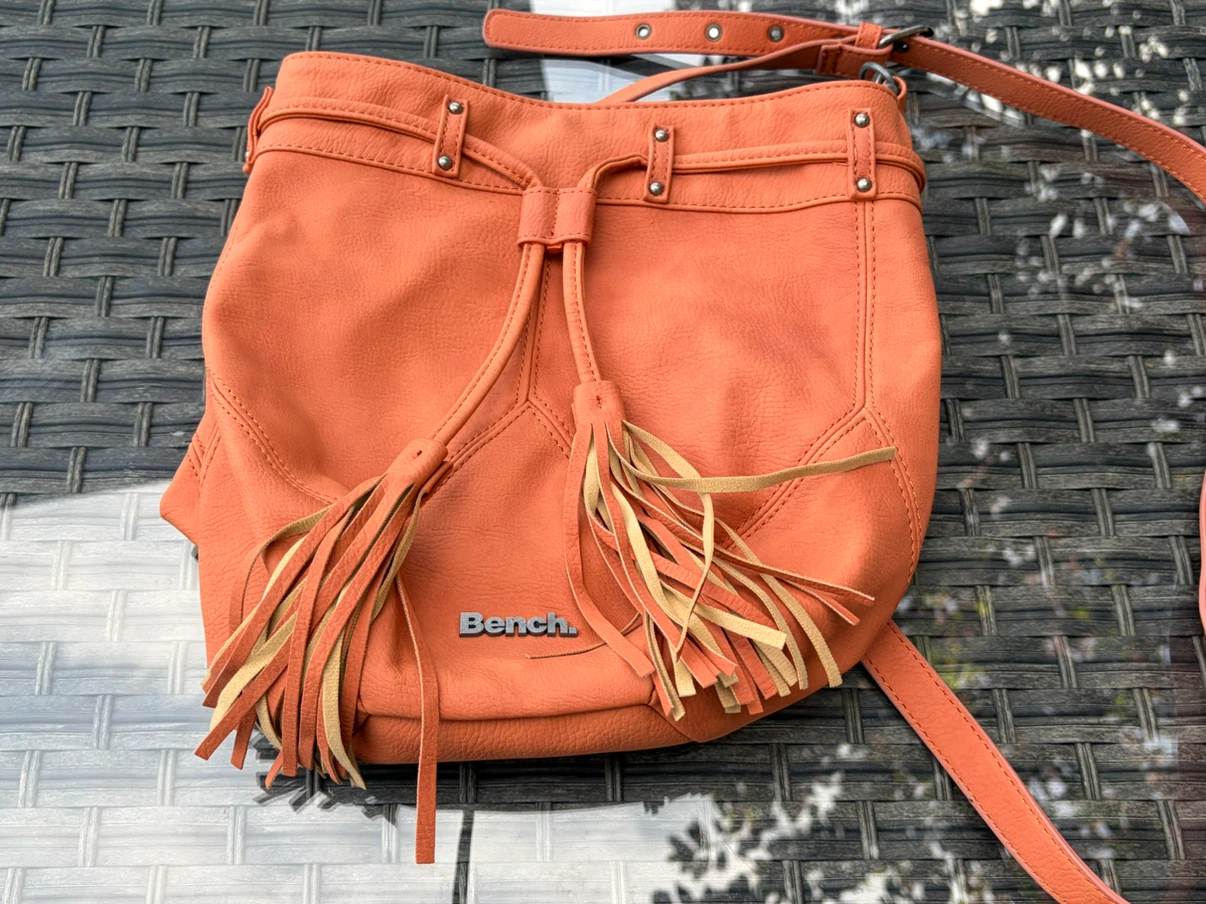Bench crossbody purse with fringe