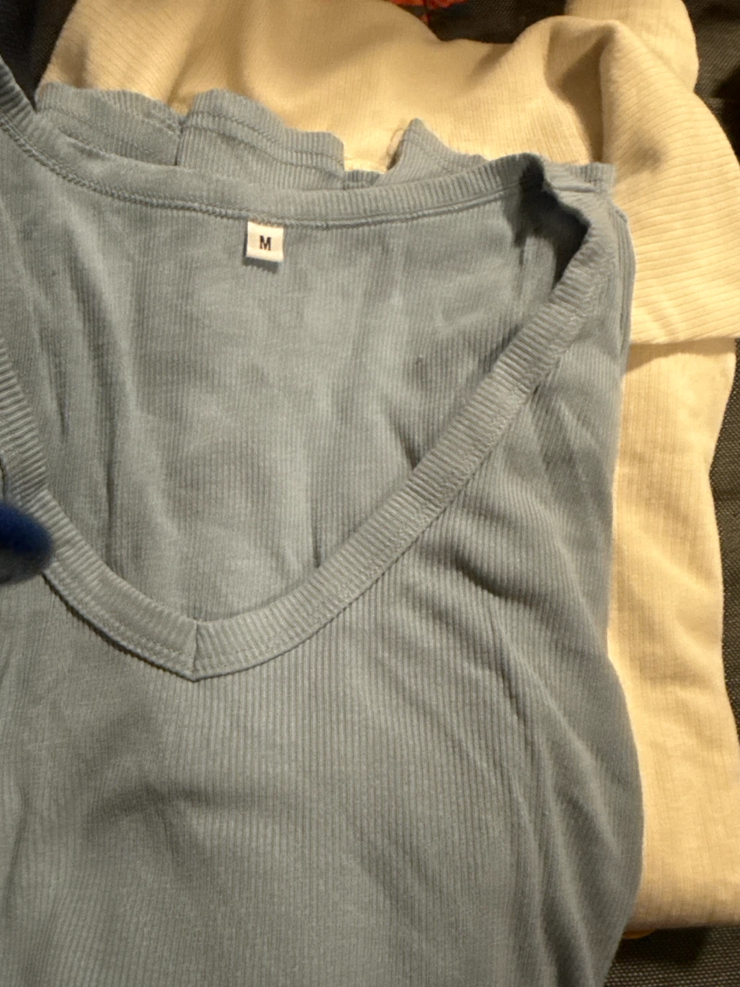Blue ribbed V-neck shirt