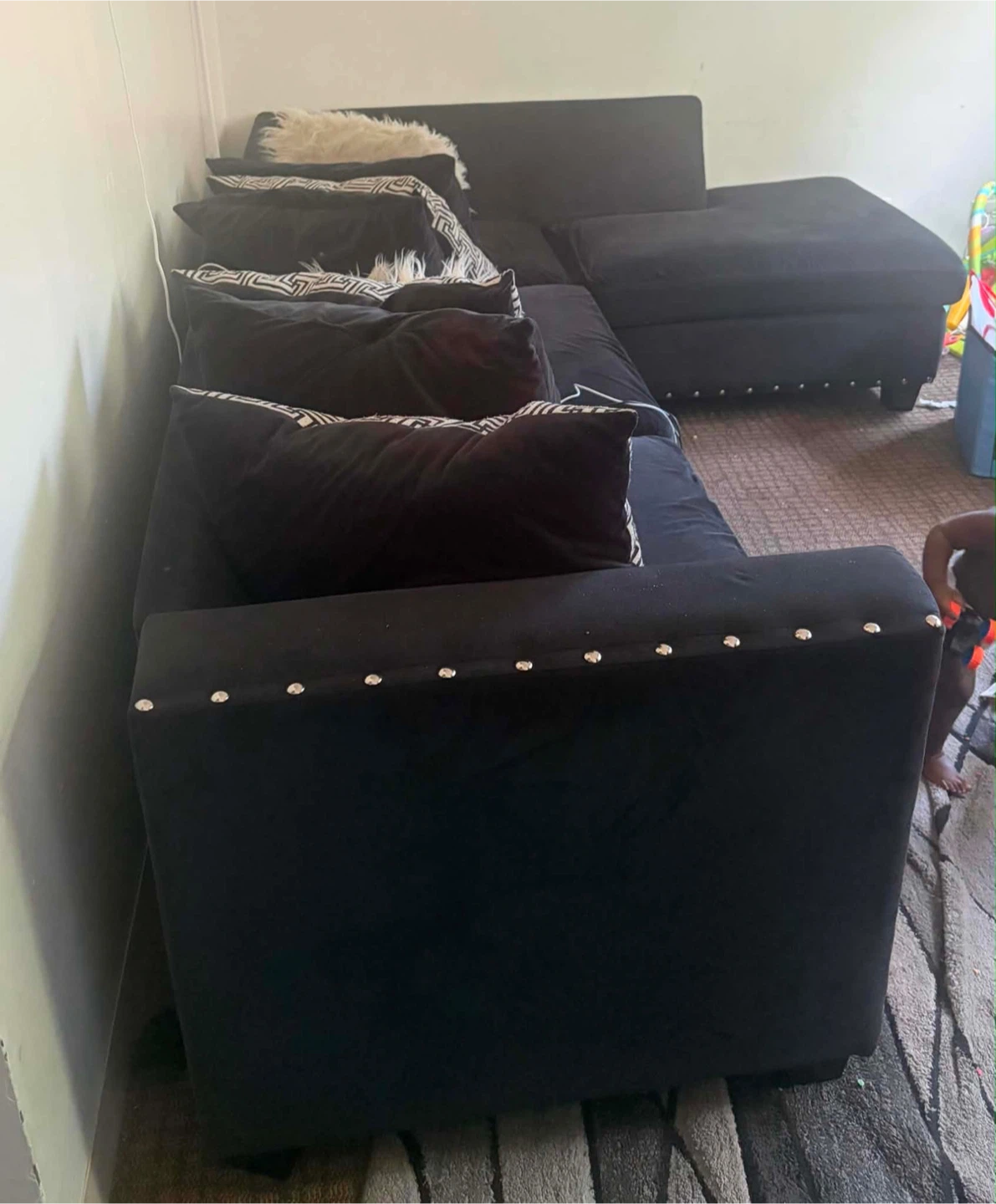 Black Velvet Sectional Sofa with Decorative Pillows