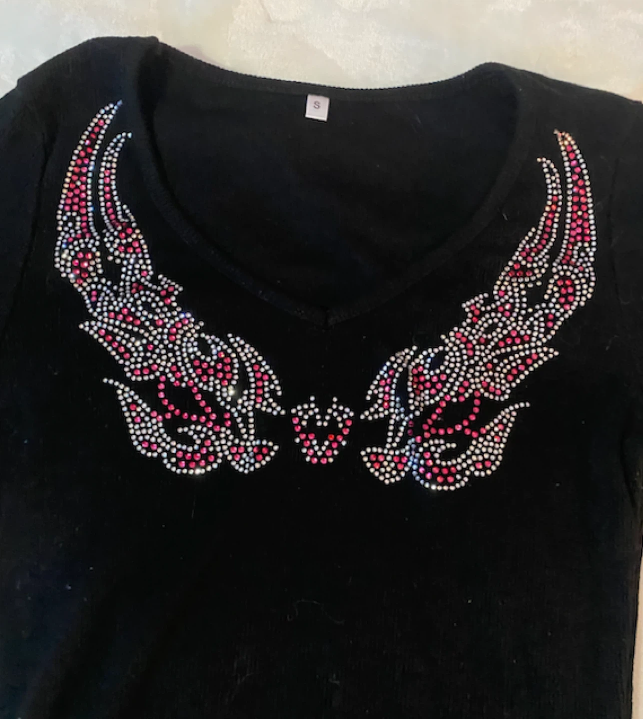 Black long-sleeve top with rhinestone wing design - photo 2