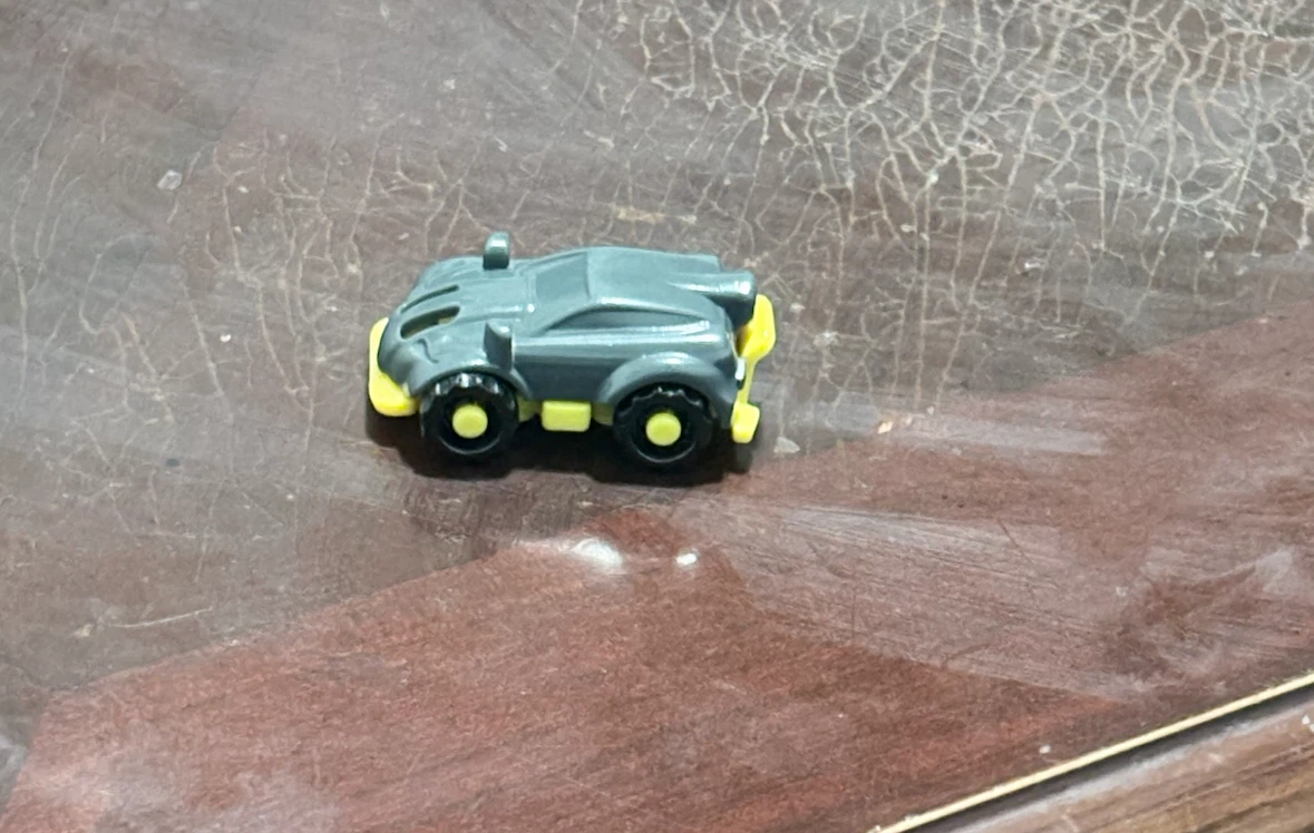Grey and yellow toy car