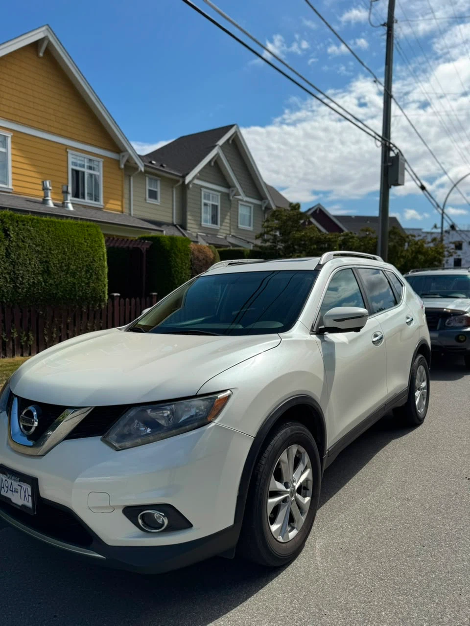 White Nissan Rogue SUV - photo 2