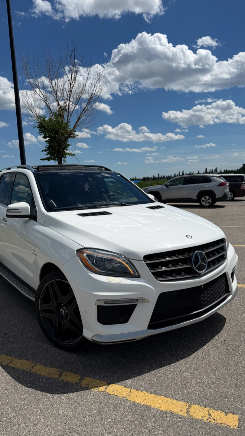 White Mercedes-Benz ML 63 AMG SUV - photo 2