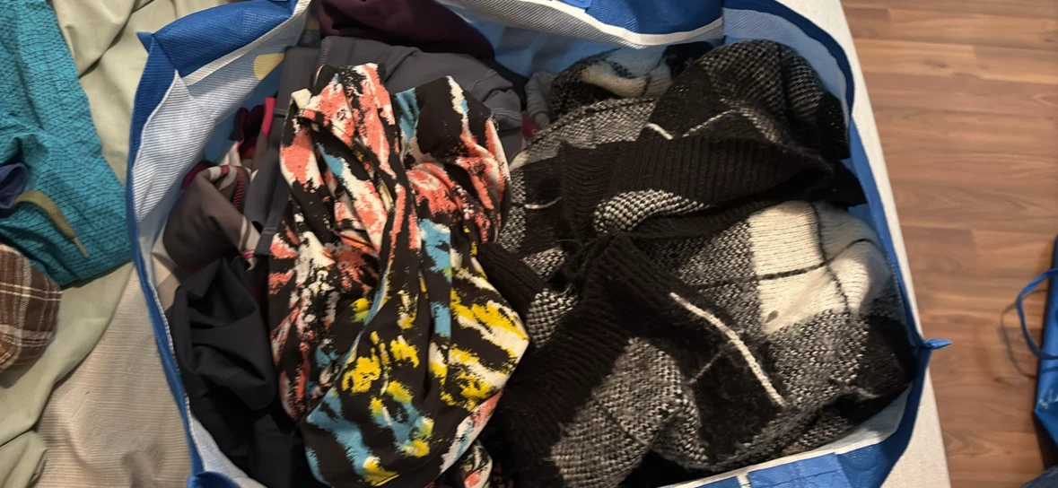 Bag of assorted adult clothing