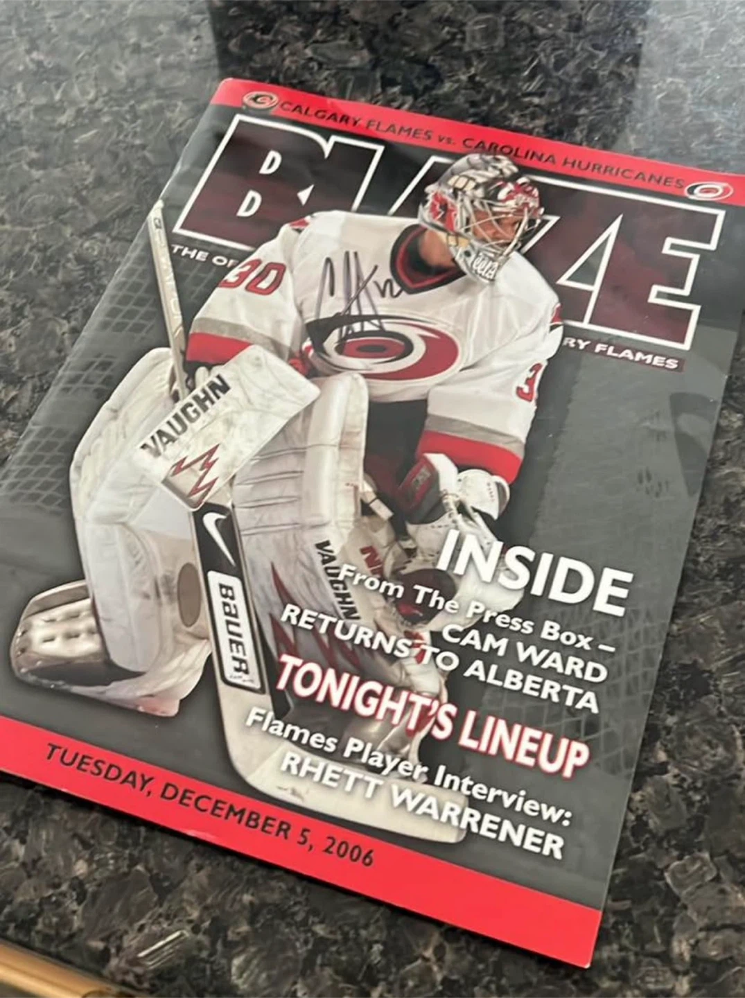 Signed Calgary Flames vs Carolina Hurricanes BUZZ Magazine