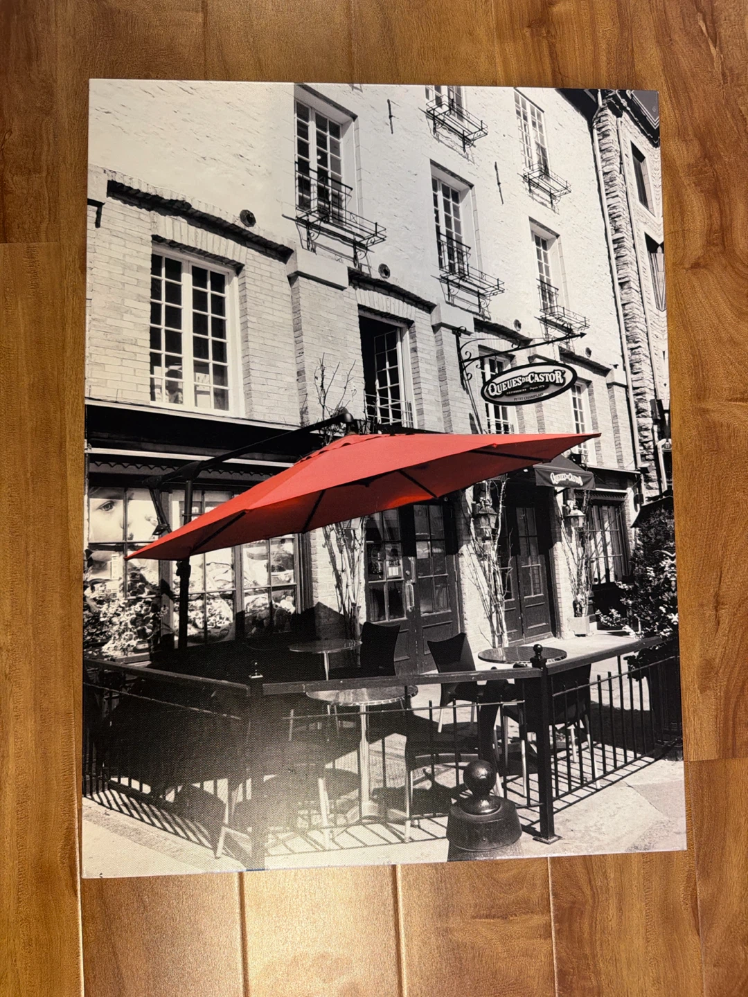 Black and White Cafe Scene with Red Umbrella Canvas Art