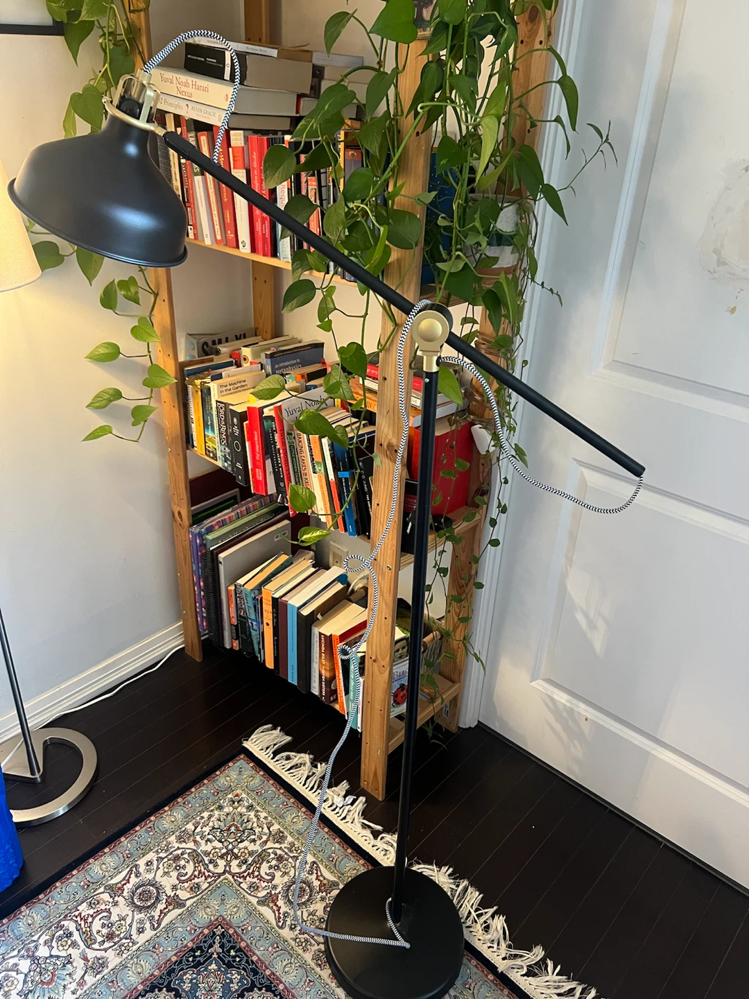 Black floor lamp with adjustable arm