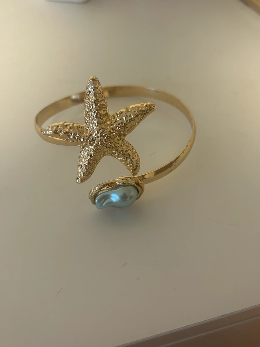 Gold Starfish Cuff Bracelet with Pearl Accent