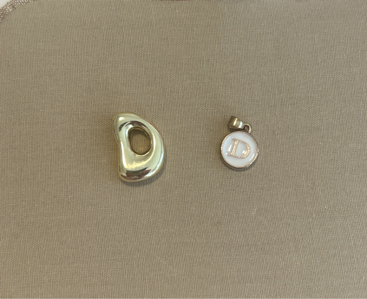 Gold tone D initial charm pendant and freeform pendant