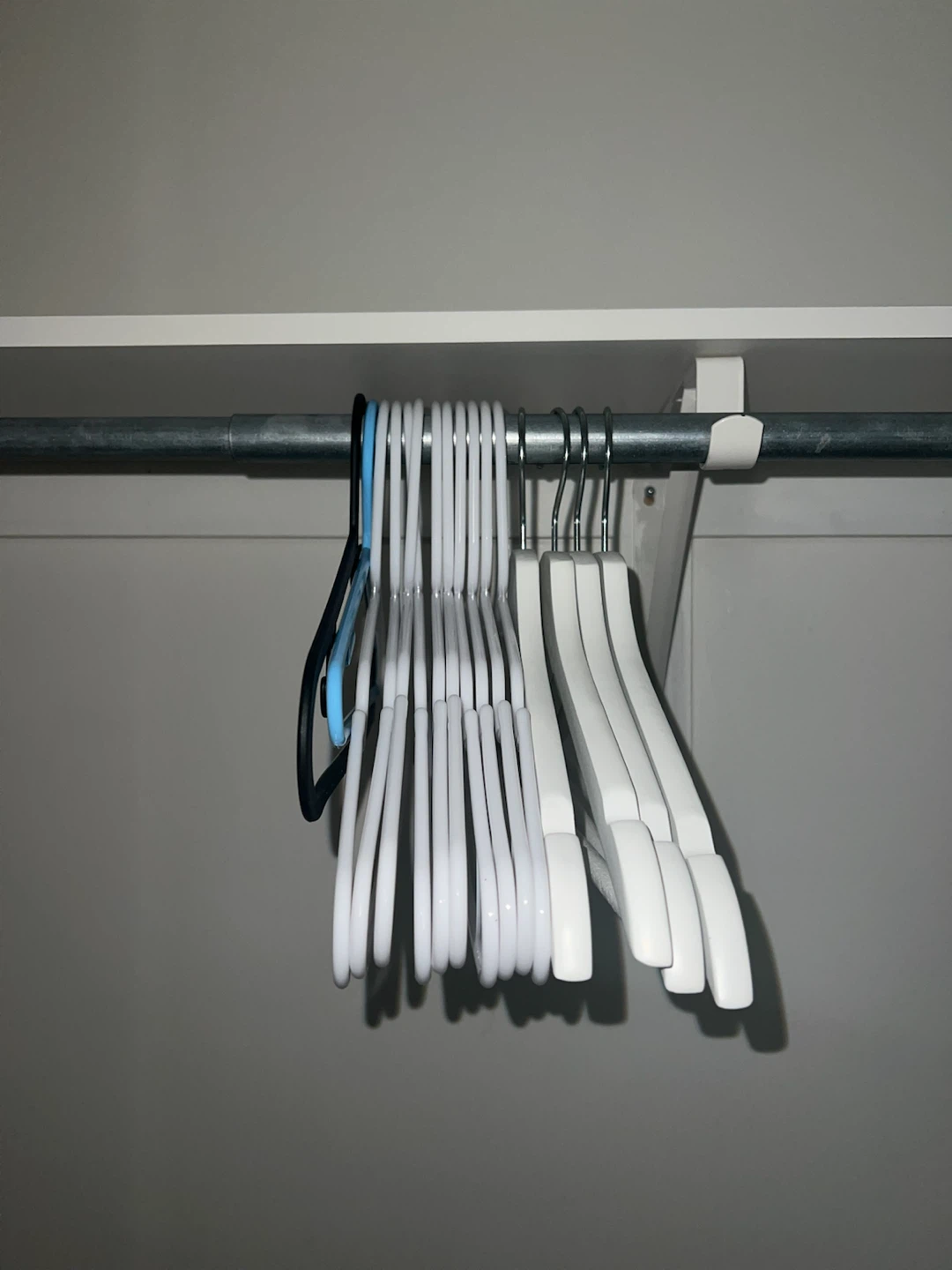 Lot of White Plastic Clothes Hangers wooden