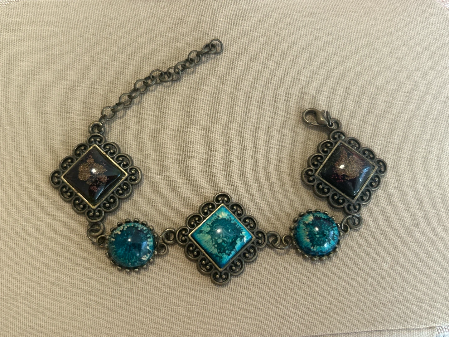Boho style bracelet with blue and dark resin charms