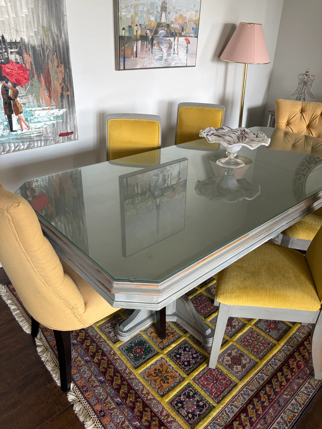 Glass top dining table with grey base and chairs