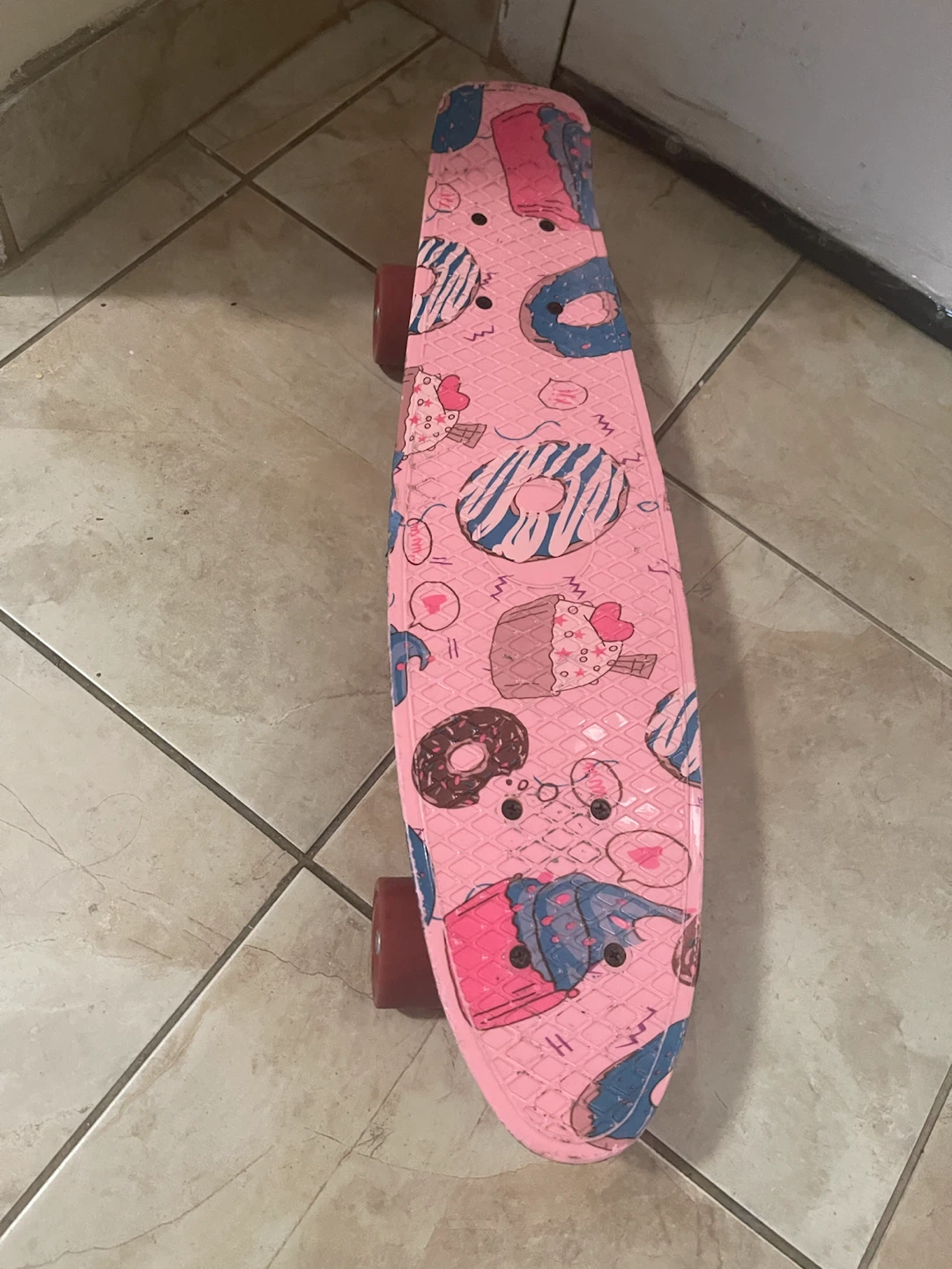 Pink Skateboard with Donut Design