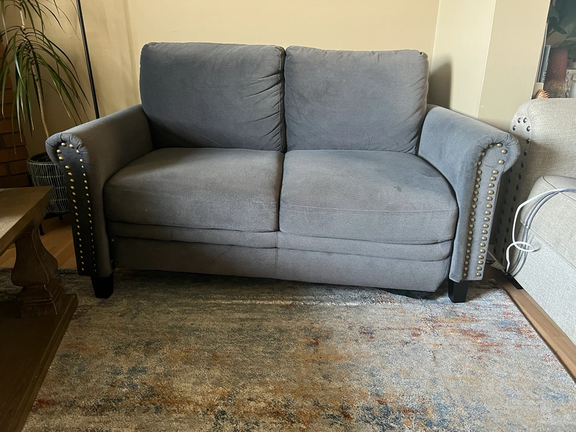 Grey Loveseat with Gold Nailhead Trim