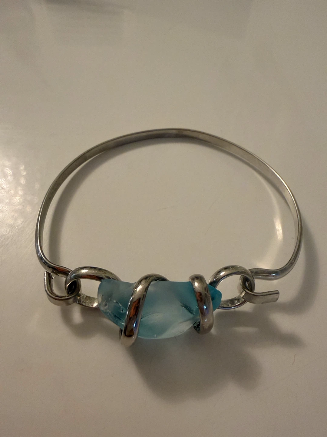 Blue sea glass and silver-tone bangle bracelet