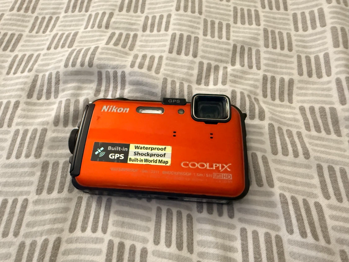 Nikon COOLPIX AW100 Orange Waterproof Camera with charger