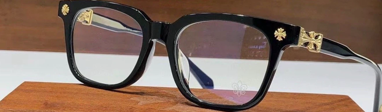 Black designer glasses with gold accents