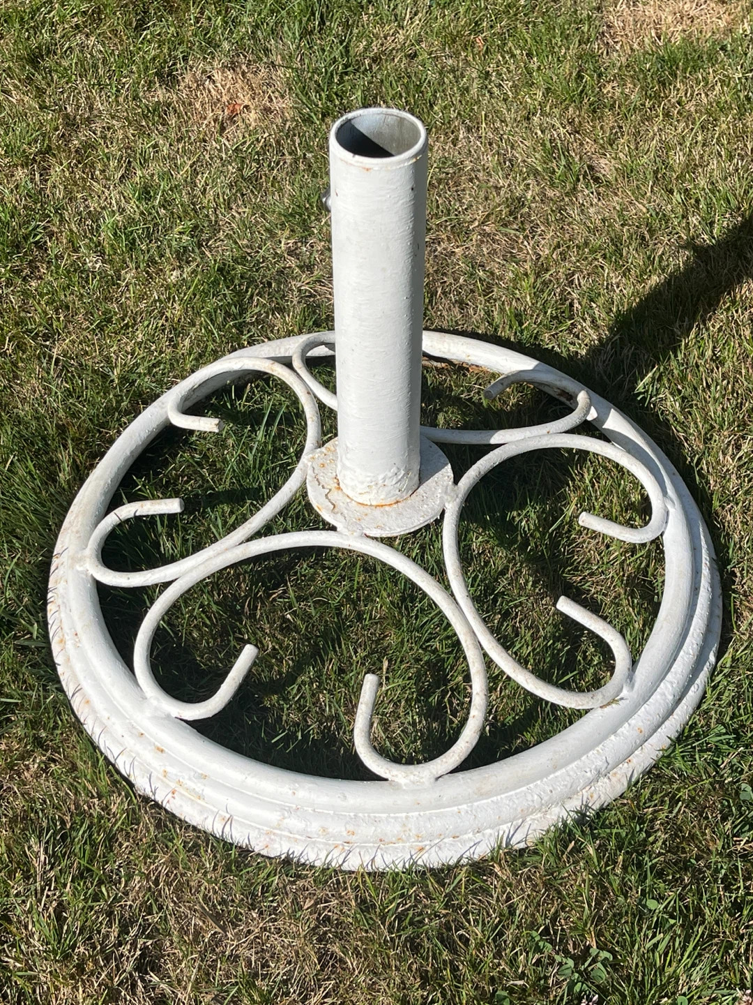 White metal patio umbrella stand
