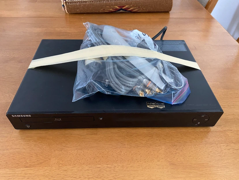Samsung Blu-ray Player with Cables and DVDs