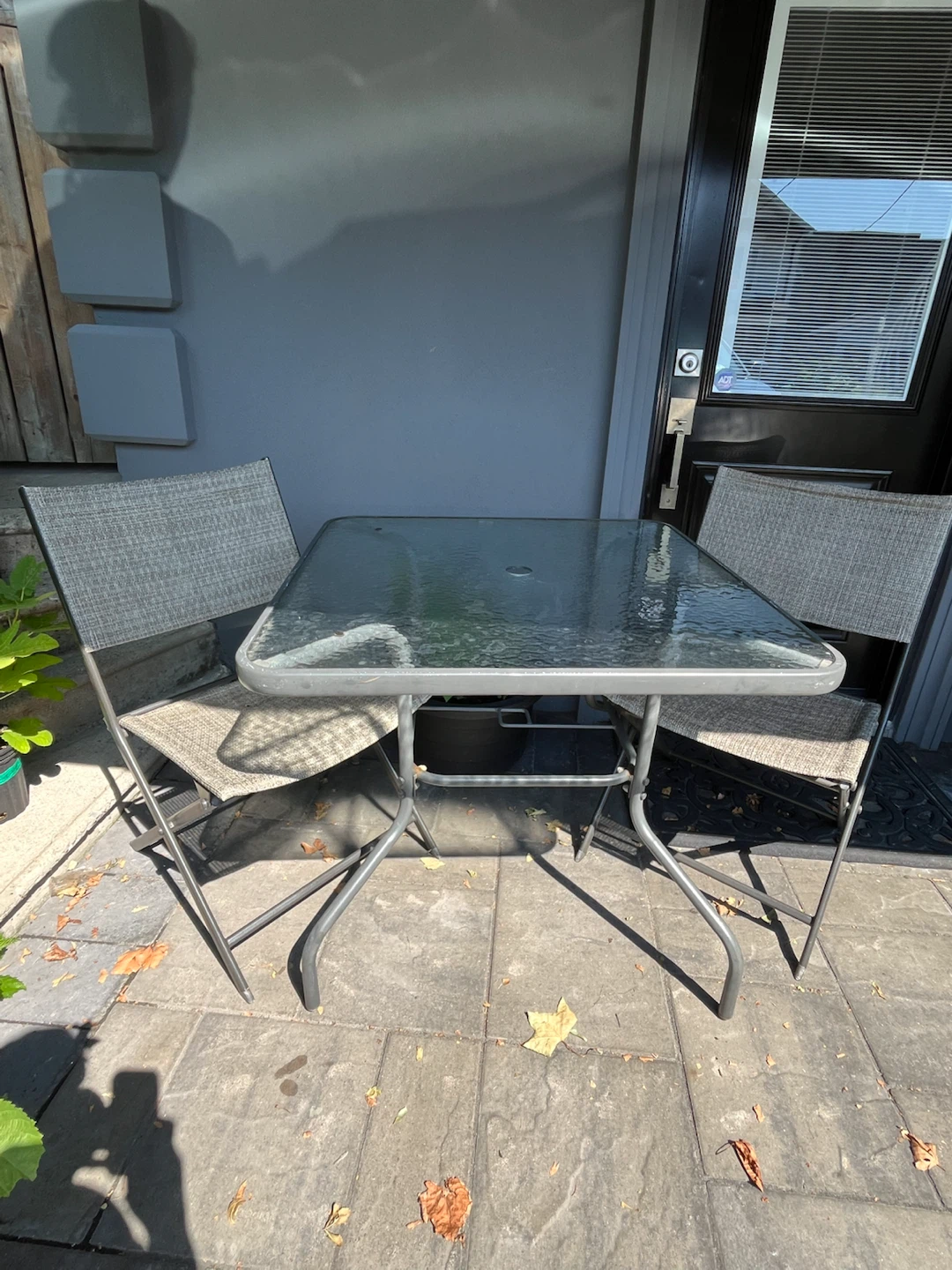 Glass top patio table and chairs set