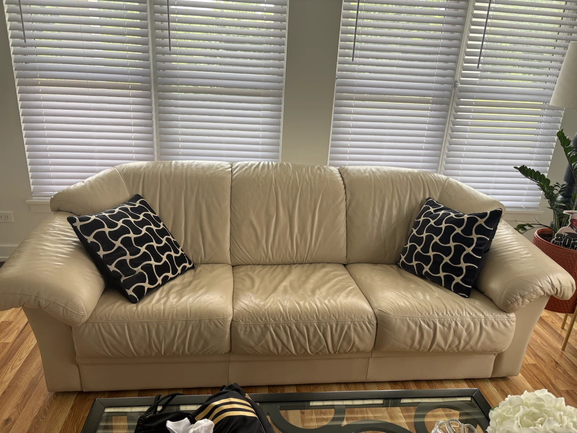 Cream Leather Sofa with Decorative Pillows
