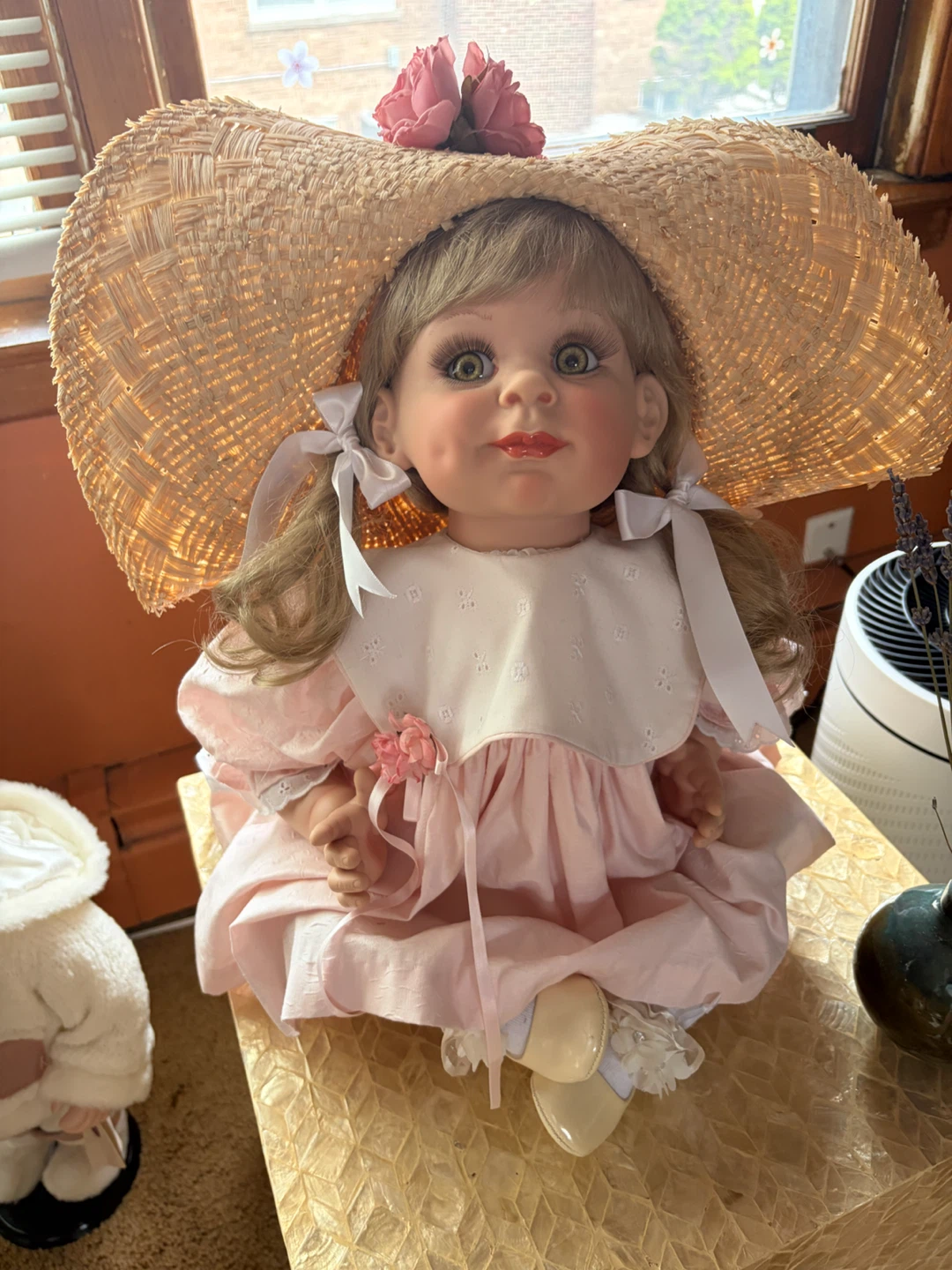 Vintage Porcelain Doll with Straw Hat