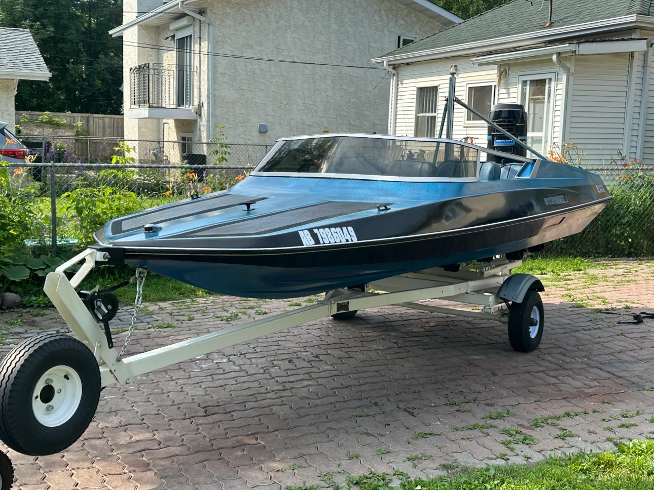 Blue Speed Boat with Mercury Outboard Motor