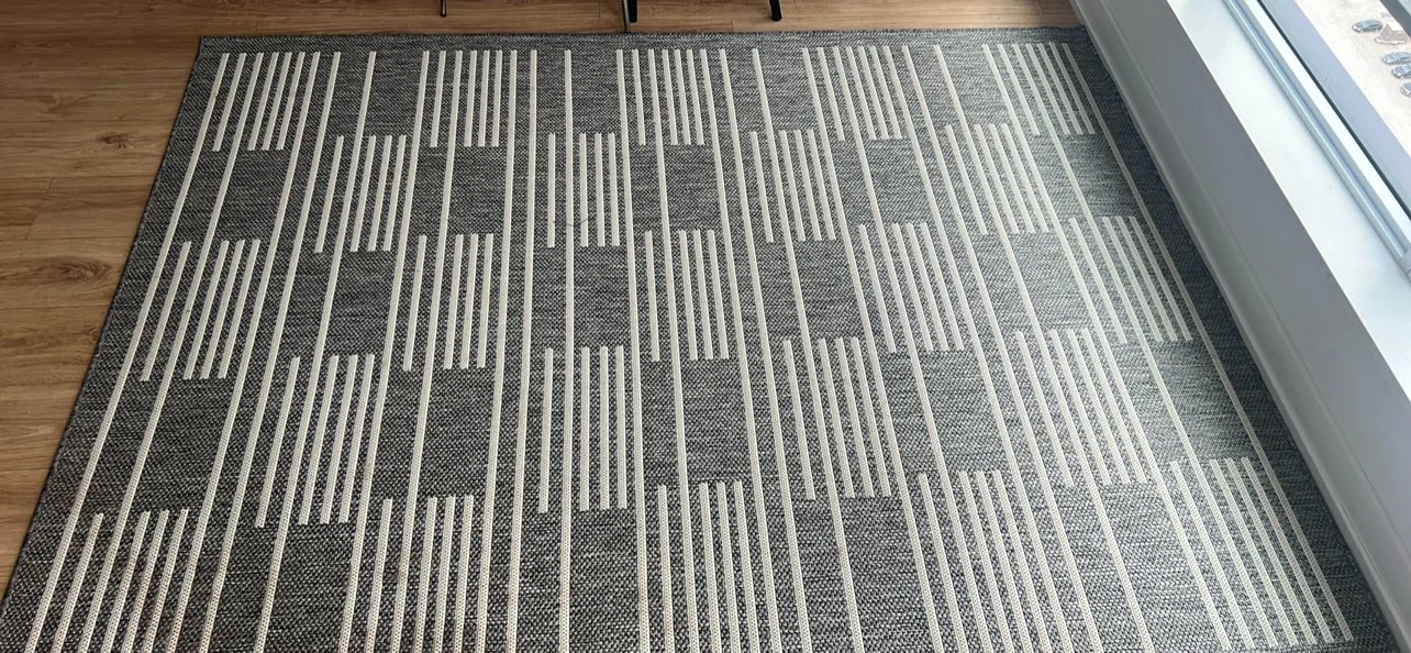 Grey and white striped area rug