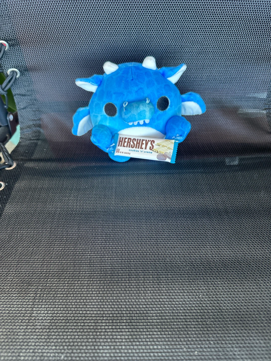 Blue monster plush with Hershey's Cookies 'n' Creme bar
