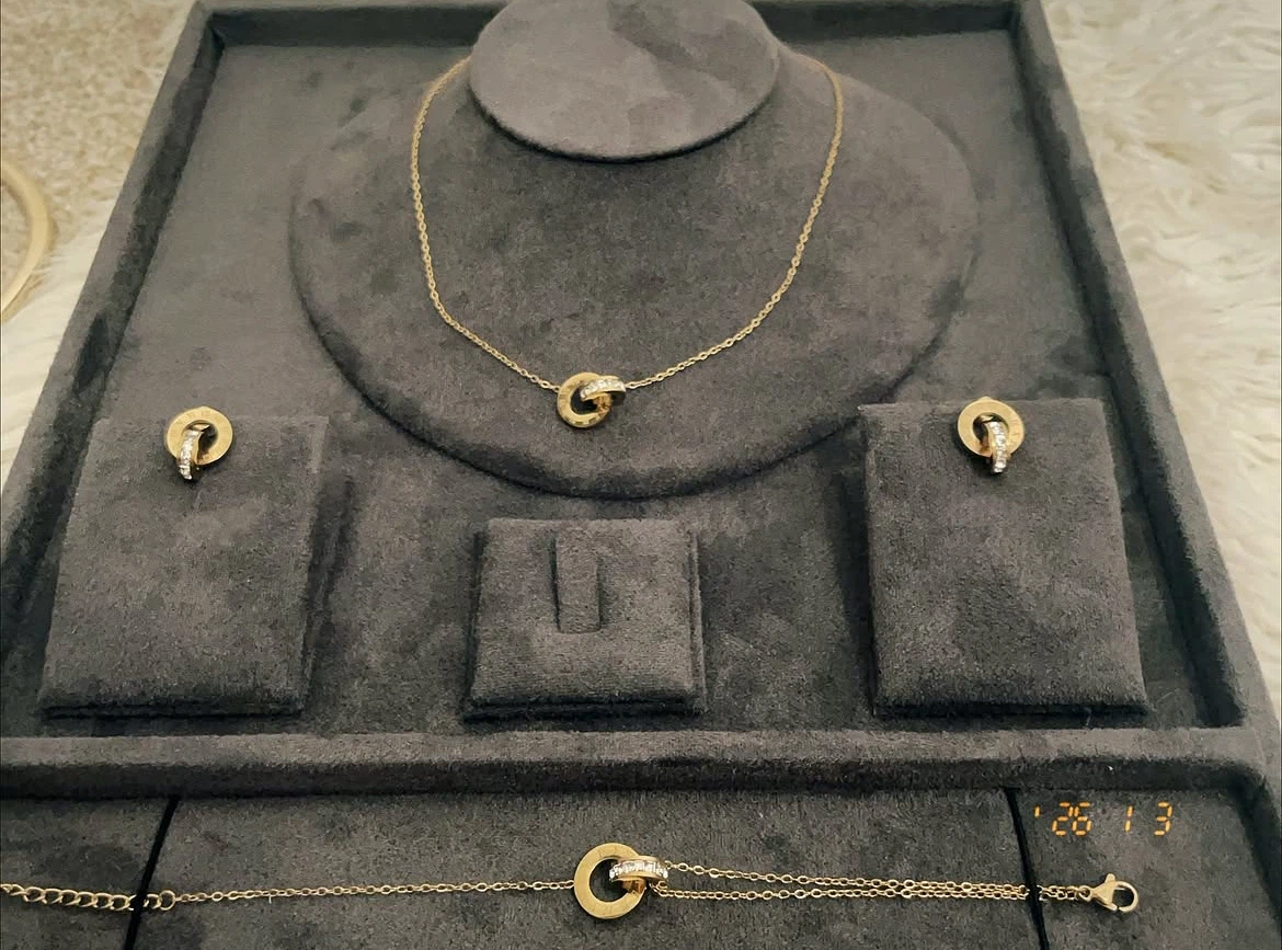Gold Tone Interlocking Circle Necklace with Roman Numerals