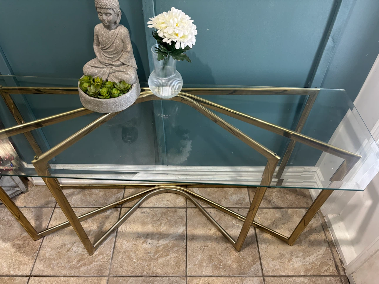 Glass top console table with brass frame