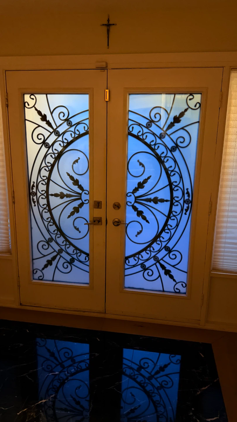 Double Entry Doors with Decorative Wrought Iron