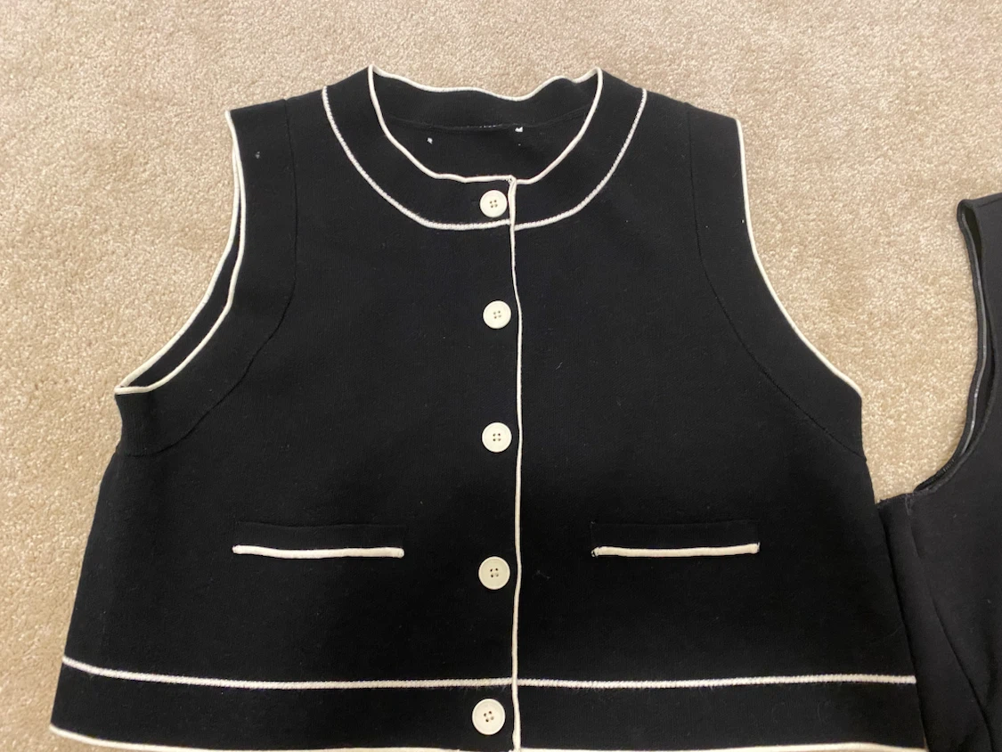 Black Sleeveless Knit Top with White Trim