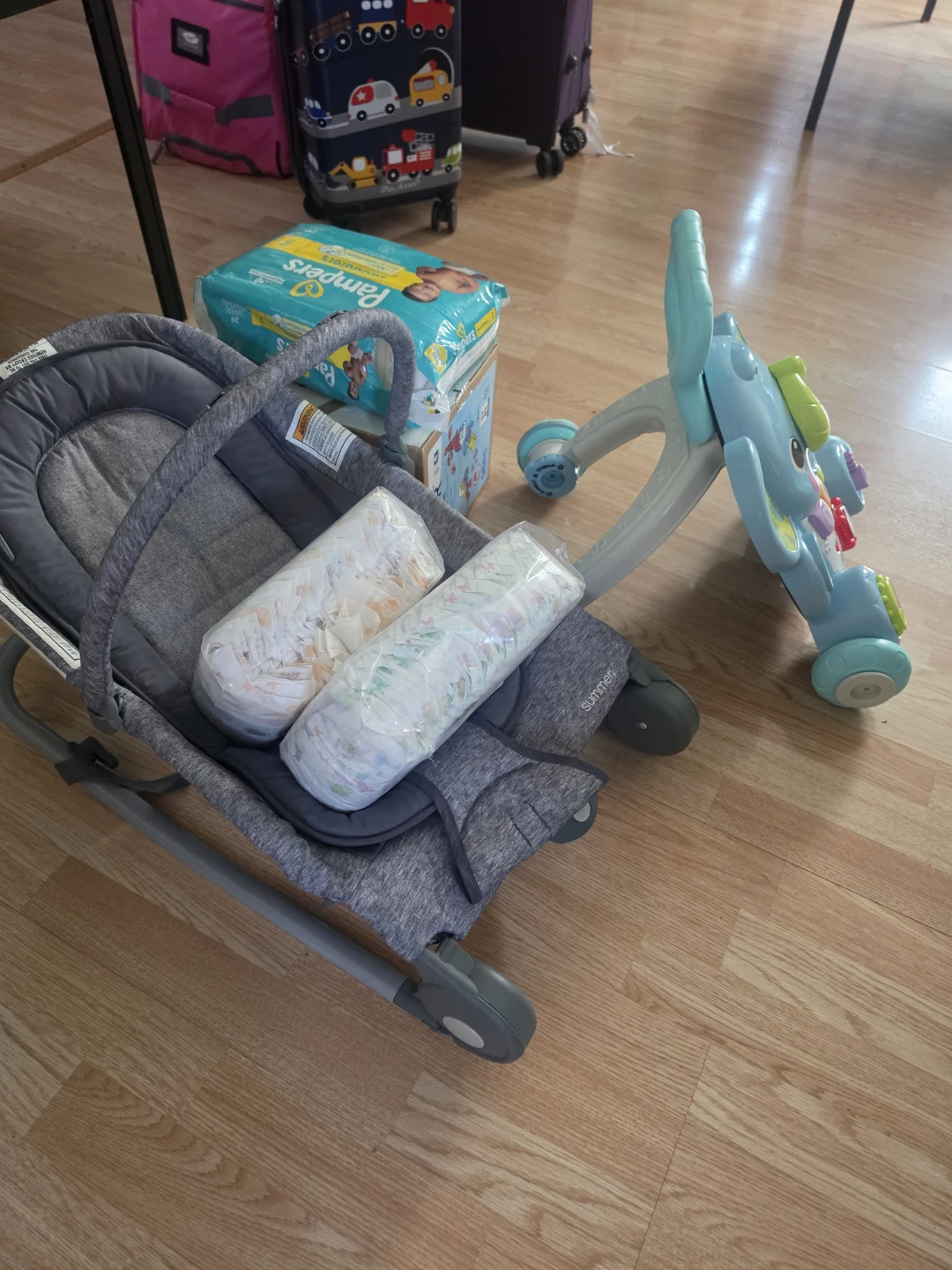 Pampers Swaddlers Diapers, Baby Rocker, and Walker Toy