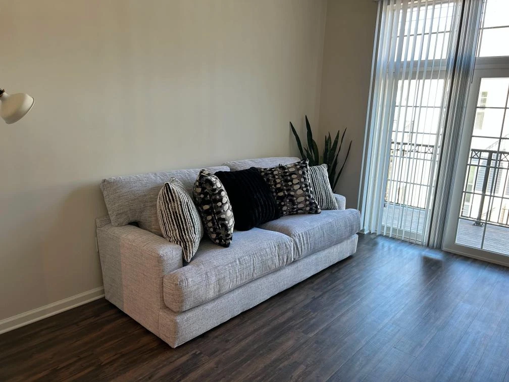 Gray Textured Sofa with Decorative Pillows