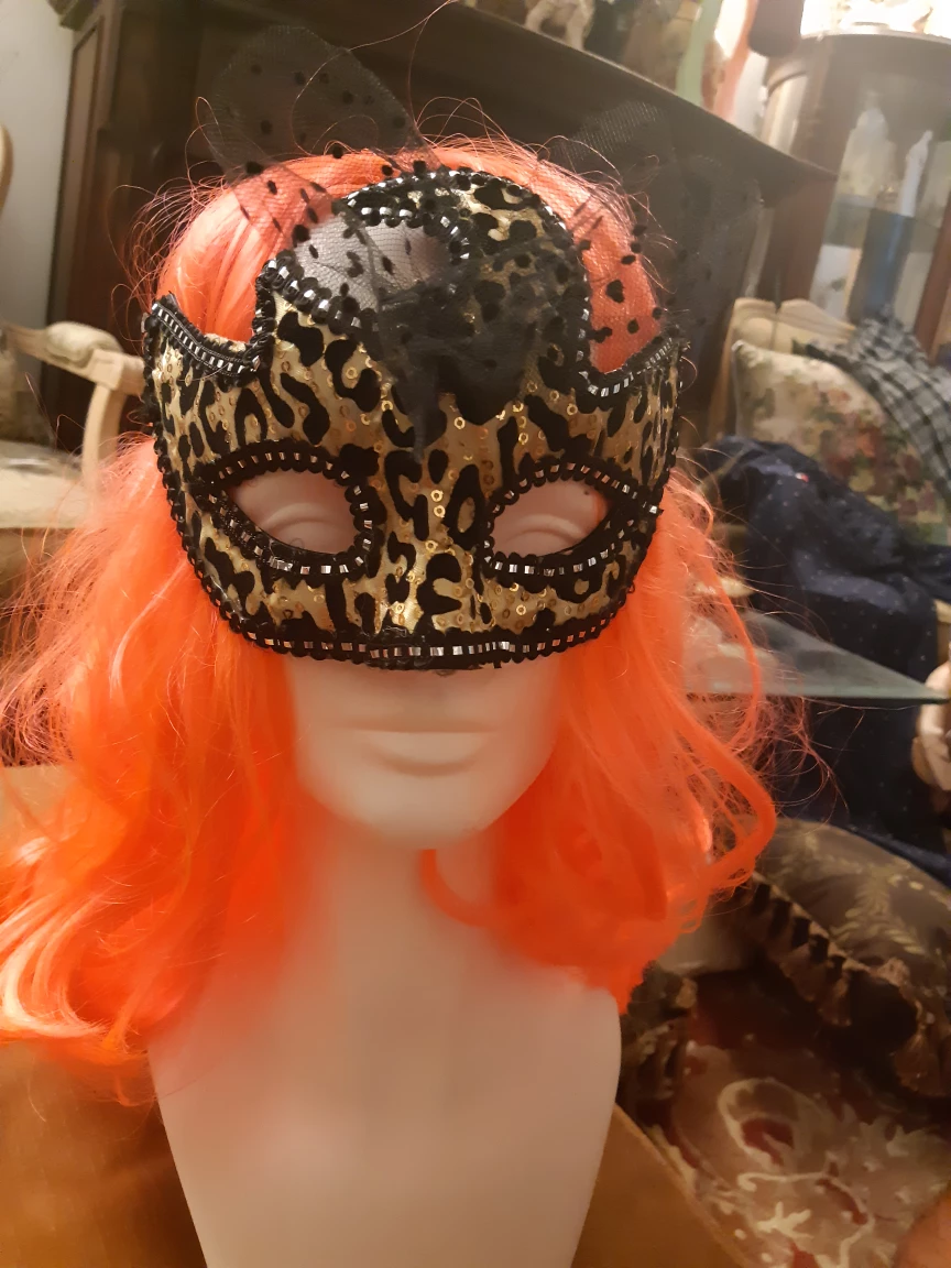 Leopard print masquerade mask with embellishments