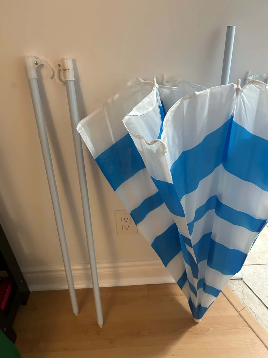 Blue and White Striped Beach Umbrella with Two Poles
