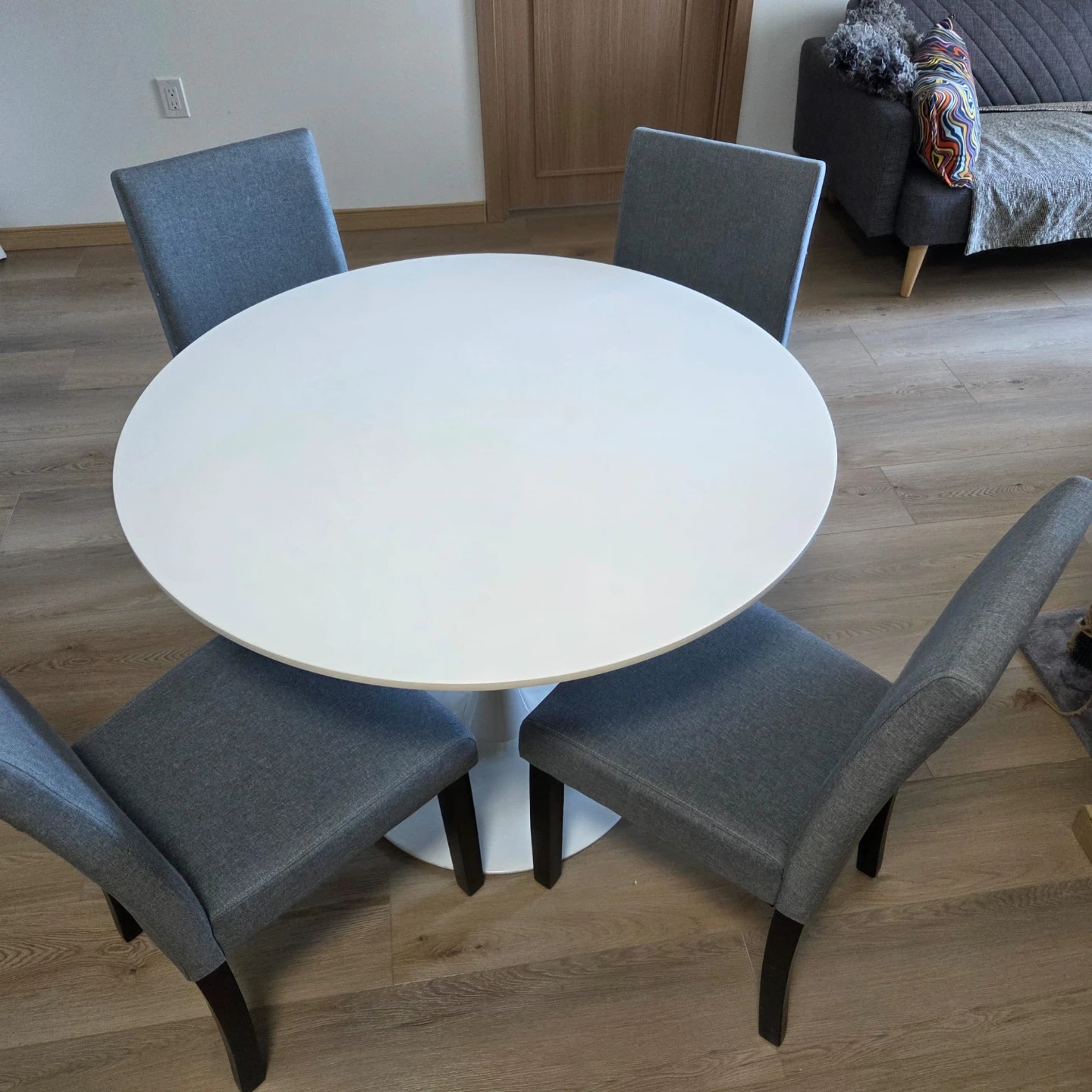 White Round Dining Table with 4 Grey Chairs