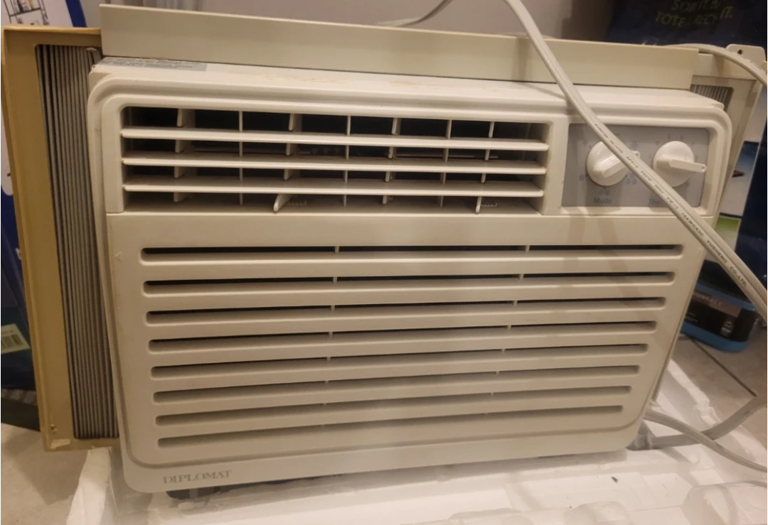 Small window air conditioner and plexiglass