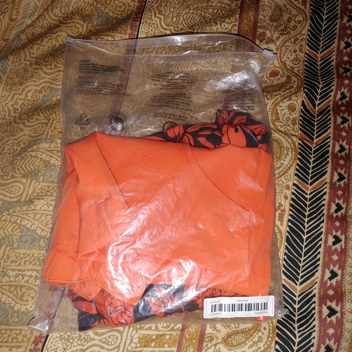 Orange floral print shorts and sleeveless top set