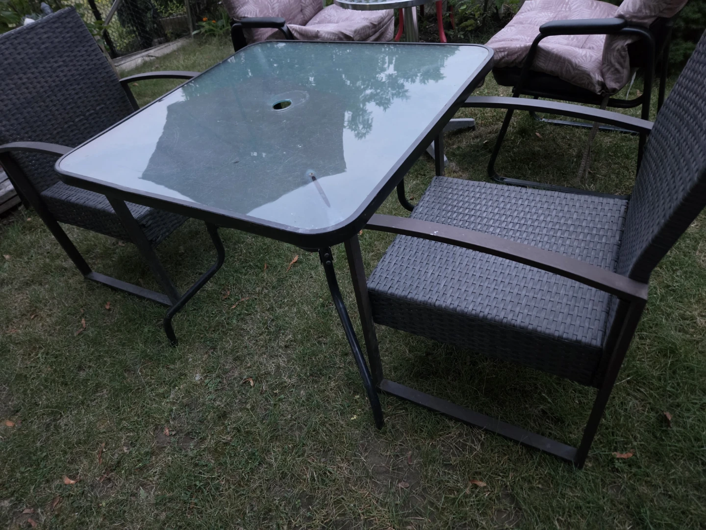 Glass Top Patio Table with Wicker Chairs