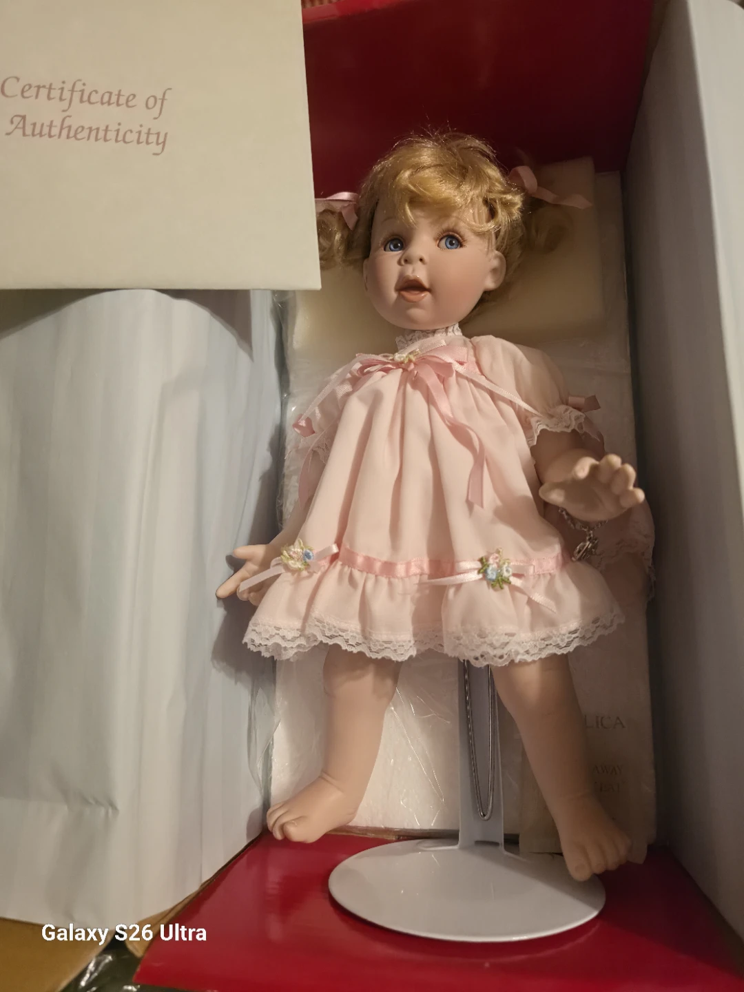 Collectible Porcelain Doll in Pink Dress