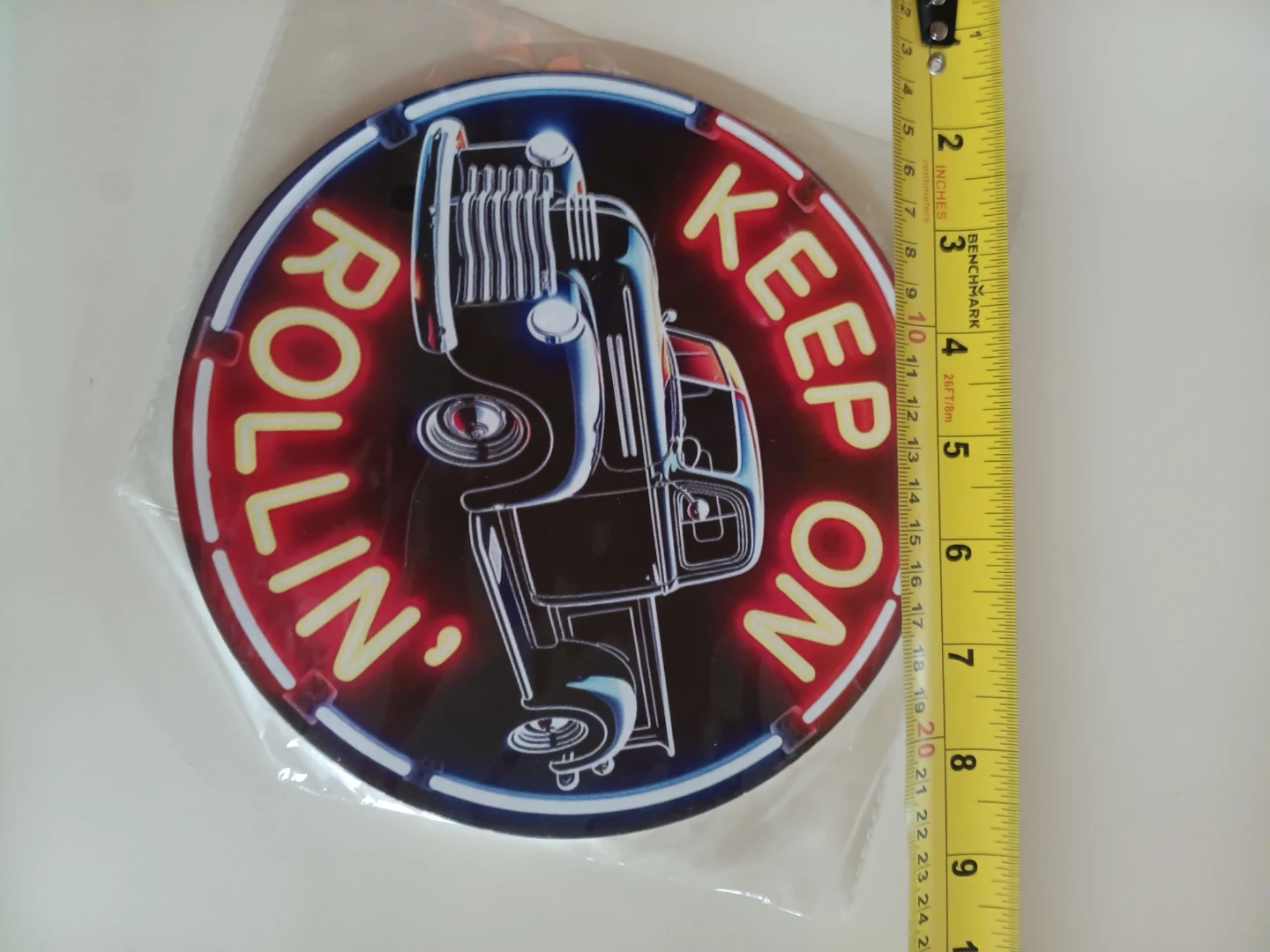 Keep On Rollin' Round Tin Sign