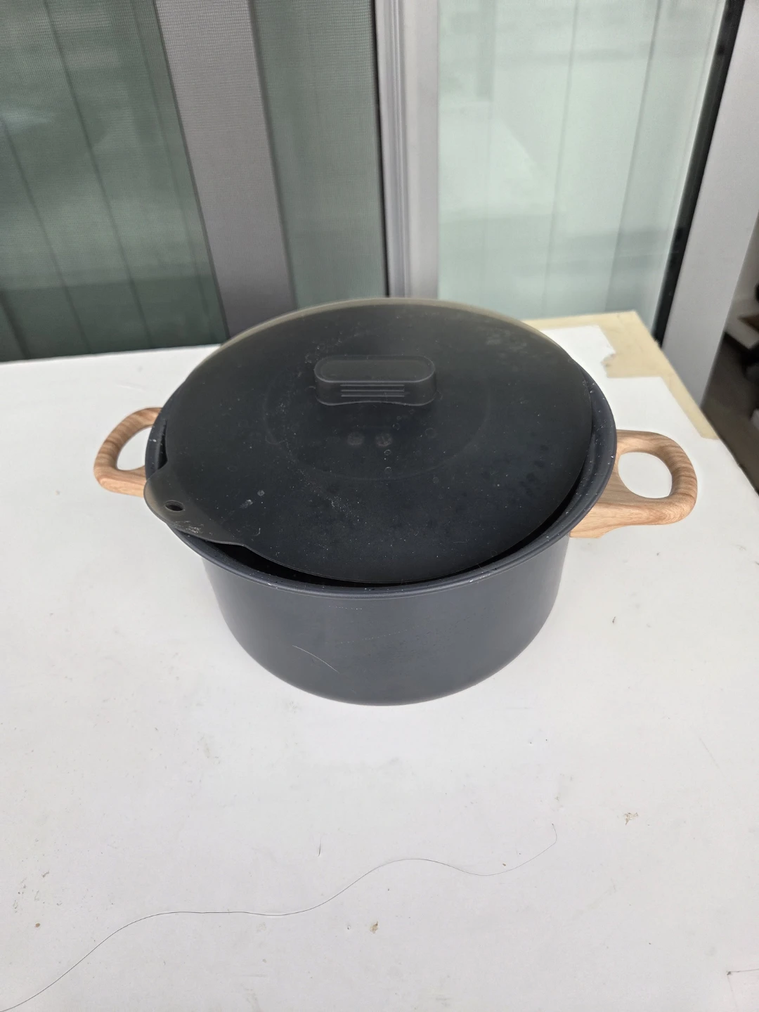 Black Pot with Wooden Handles and Lid