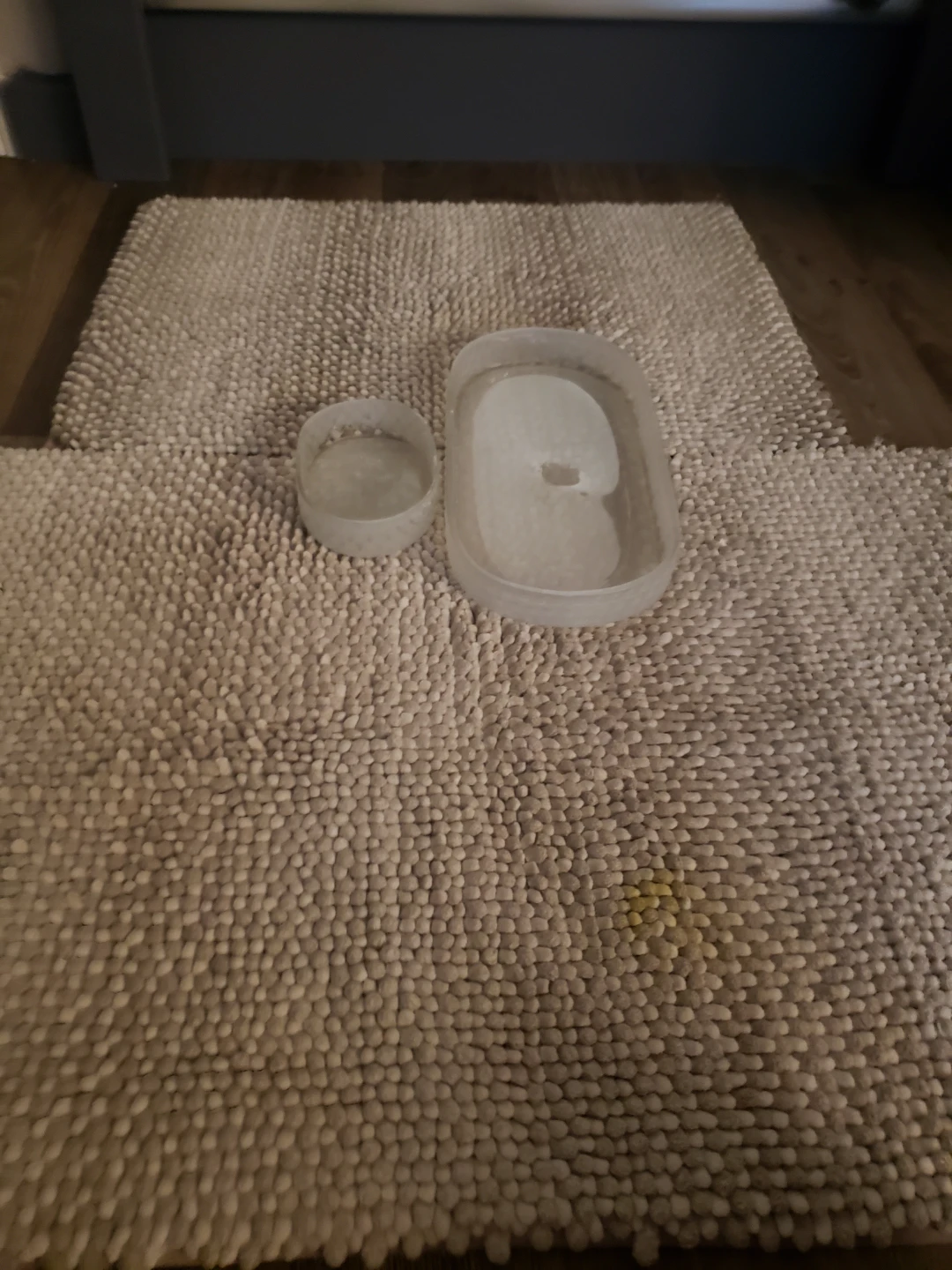 Two plastic containers with lids plus mats