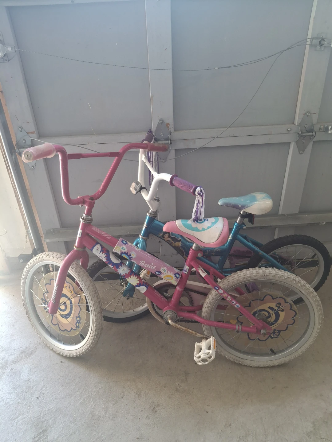 2 girl bikes (barbie) and (princess jasmine) f