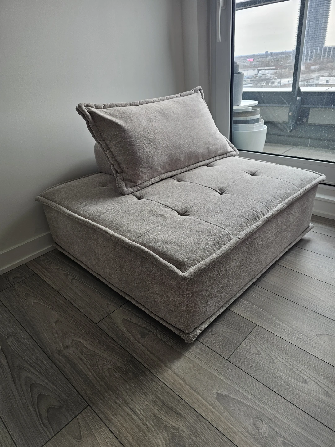 Grey Lounge chair with pillow