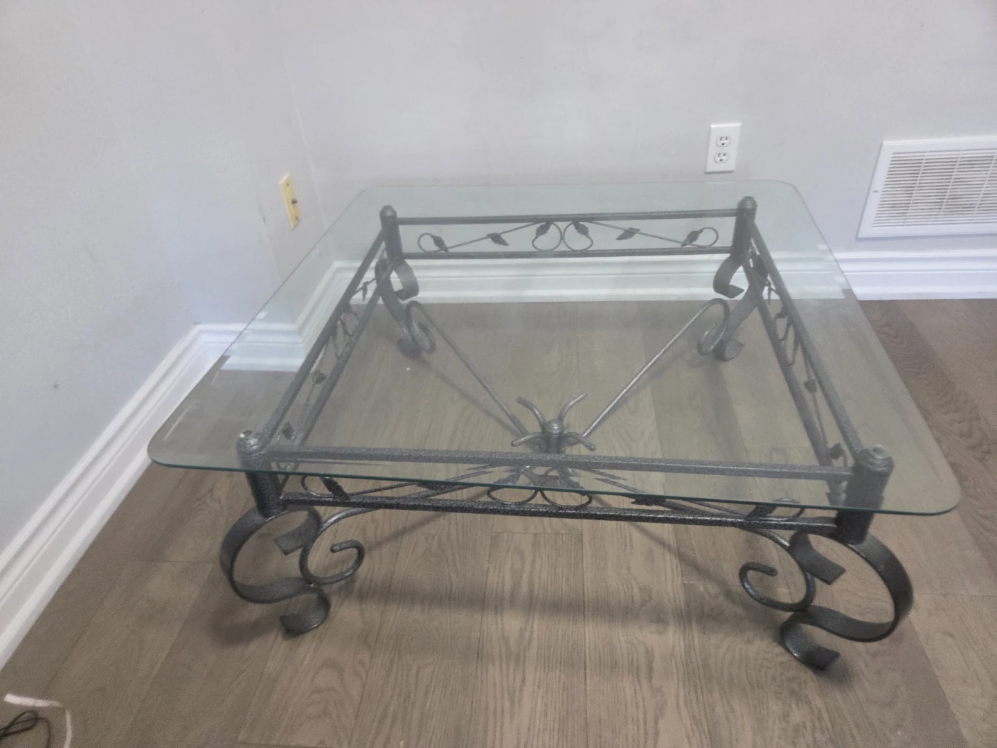 Glass top coffee table with metal base