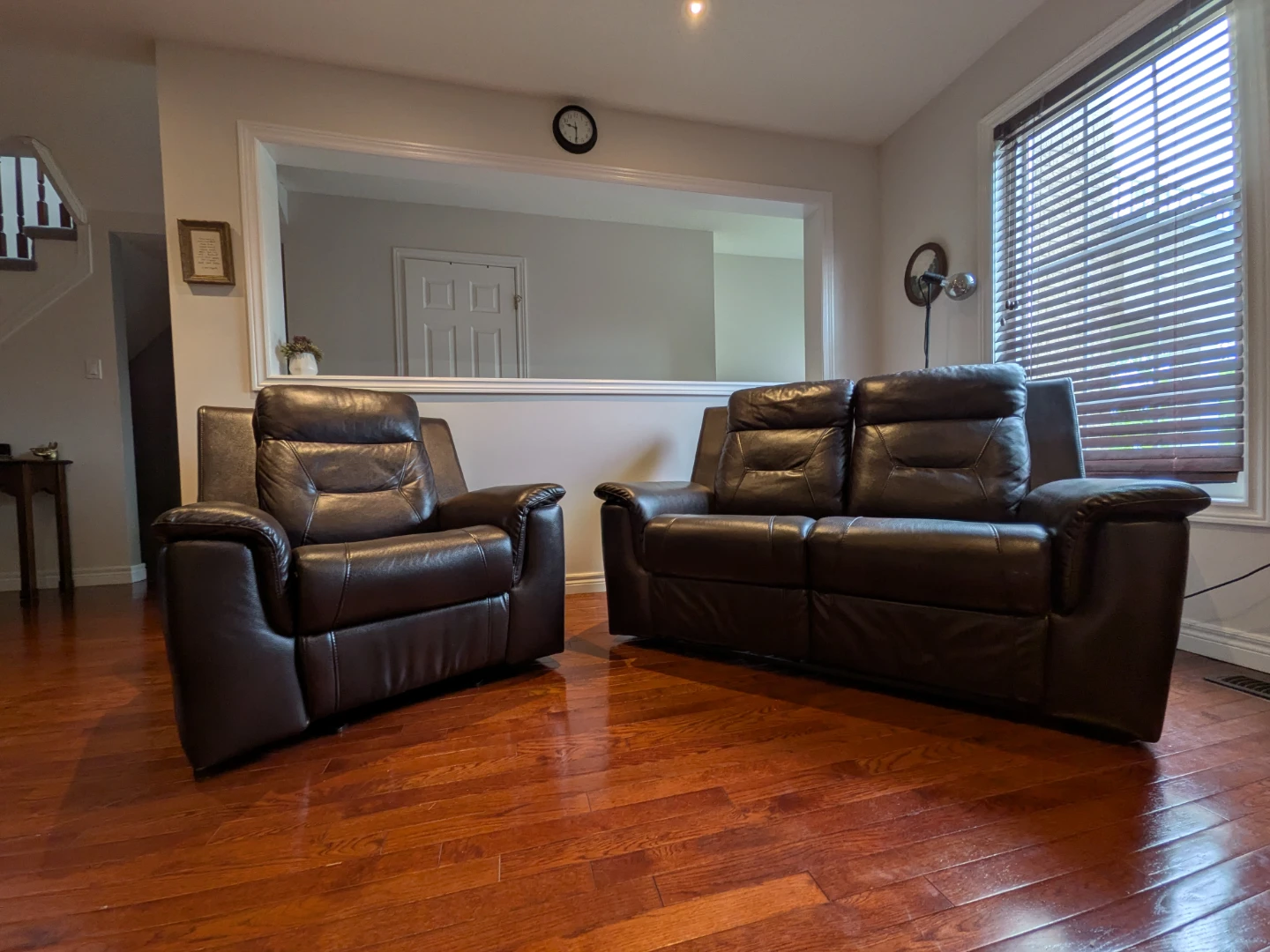 Brown Leather Reclining Loveseat and Armchair